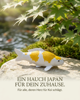 Hariwake Koi-Figur als stilvolle Japan Deko auf einem Stein im Garten für Koi- und Japan-Liebhaber